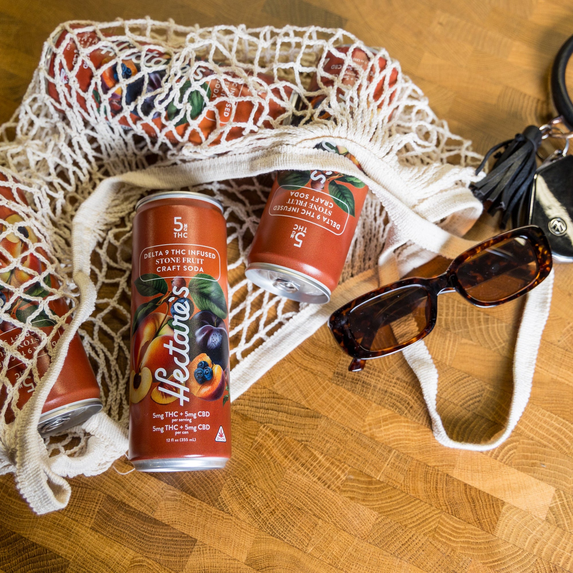 Grocery bag full of Hectare's Stone Fruit Delta 9 Craft Sodas.
