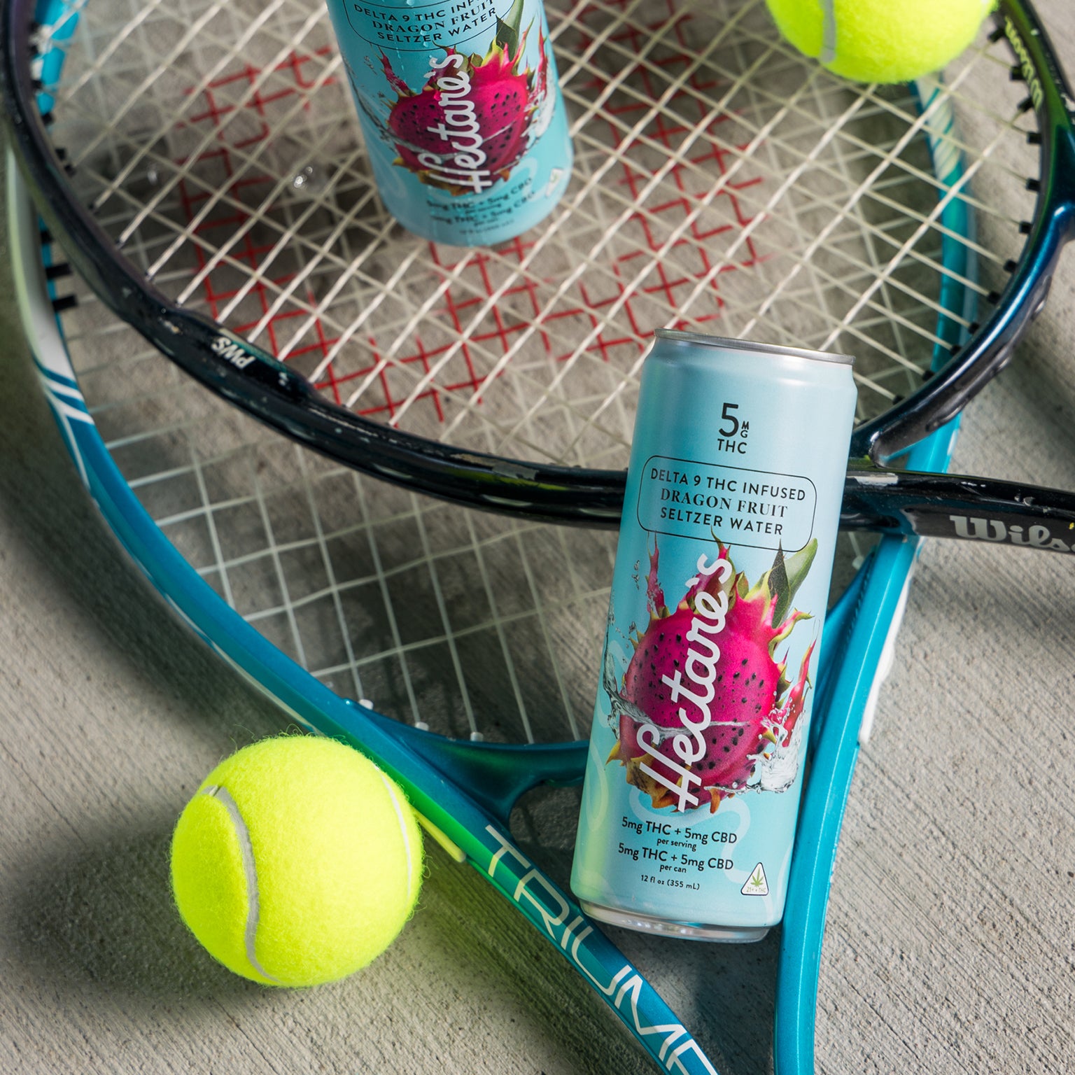 Tennis rackets and cans of Hectare's Dragon Fruit Delta 9 Seltzer Water.